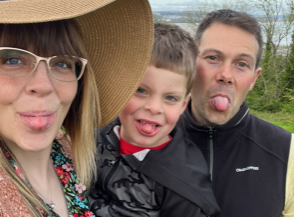 image5 Mother, son and father sticking out tongues